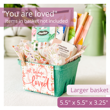 Load image into Gallery viewer, Image of a green basket, elegant tag featuring a delicate butterfly and floral print in the background. The text on the tag reads: Just because you are loved. Also features tissue paper with a gorgeous floral and butterfly print. The basket is filled with self care gift items. Text overlay on image reads: You are Loved. Items in basket not included. Larger Basket. 5.5 x 5.5 x 3.25.