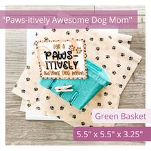 Load image into Gallery viewer, Image of green berry basket, cute tan colored tag with black paw prints in the background. It says: For a Paws-itively Awesome Dog Mom. Has a cute heart with a paw print under the text. Also features cute kraft tissue paper with paw prints covering it. Text overlay on image reads: Paws-itively Awesome Dog Mom. Green Basket. 5.5 x 5.5 x 3.25.