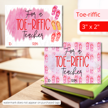 Load image into Gallery viewer, Two tags size 3" x 2". They read: "For a Toe-riffic Teacher." One tag has a white background with a dark pink splatter behind the words and has 1 red, 1 pink and 1 yellow flip flops on the right side. The other tag has a pink background with pink and red flip flops all over the background. There is a pink splatter behind the words.