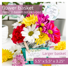 Load image into Gallery viewer, Green berry basket holding flowers. Has a round tag sticking out of the flowers that says Happy Mother&#39;s Day. Also has a rectangular tag clipped to the front of the basket with a mini clothespin. The tag reads: &quot;A mother&#39;s love is more beautiful than any fresh flower.&quot; Debashish Mridha. The elegant tags feature delicate greenery. Text is overlaid on image. The text reads “Flower Basket: Items in basket not included,” and “Larger basket 5.5” x 5.5” x 3.25”
