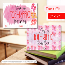 Load image into Gallery viewer, Two tags size 3&quot; x 2&quot;. They read: &quot;For a Toe-riffic Teacher.&quot; One tag has a white background with a dark pink splatter behind the words and has 1 red, 1 pink and 1 yellow flip flops on the right side. The other tag has a pink background with pink and red flip flops all over the background. There is a pink splatter behind the words.
