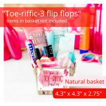 Load image into Gallery viewer, Gift basket kit in natural/tan. Striped tissue paper with pink, orange and red stripes. A tag is attached with a mini clothespin. The white tag reads, “for a toe-riffic teacher” and has 3 flip flops in red and pink on the right side of tag. The basket is filled with many items used for a pedicure. The items pictured in the basket are for presentation purposes only. The gift basket comes empty ready for you to fill.
